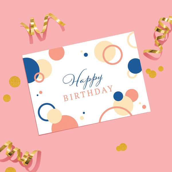 Birthday bubbles greeting card with gold confetti and streamers on a bright pink background.