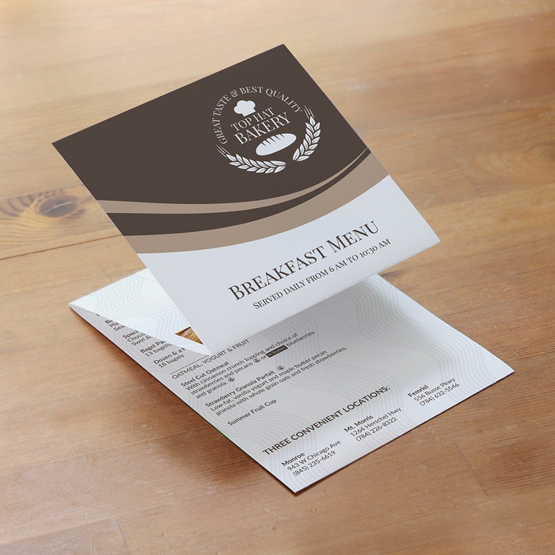 A breakfast menu is printed on a tri-fold card