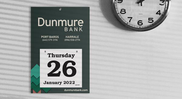 Daily Date calendar with bank logo and branding hangs on a wall