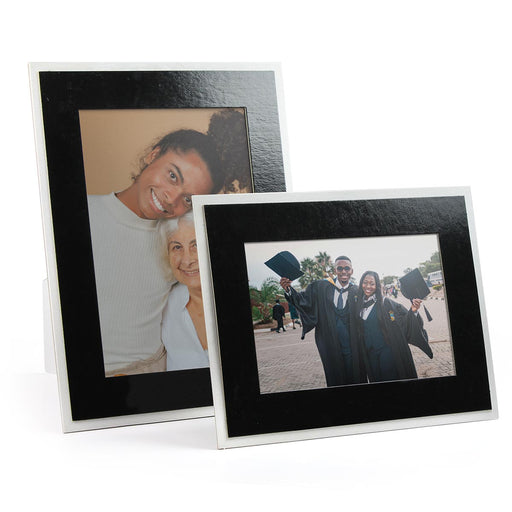 Glossy black frame with white backer. Horizontal and vertical shown.