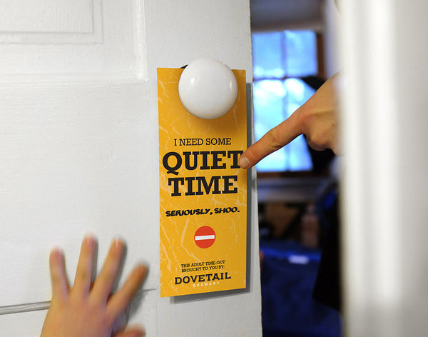 Yellow door hanger on a bedroom door says I need some quiet time