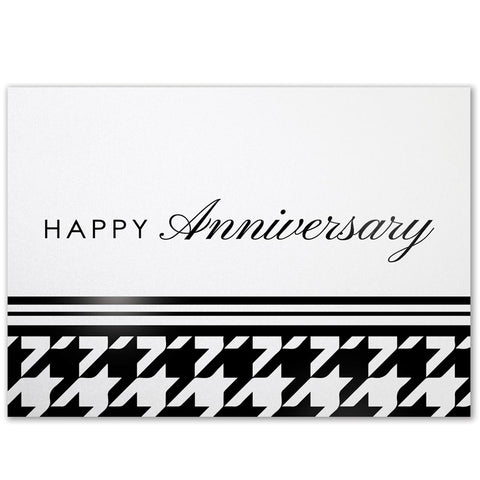 White pearlescent horizontal greeting card with black houndstooth pattern on the bottom and a modern happy anniversary greeting in the middle of the card cover.
