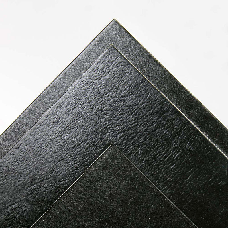 Subtle leatherette texture on black cardboard frame