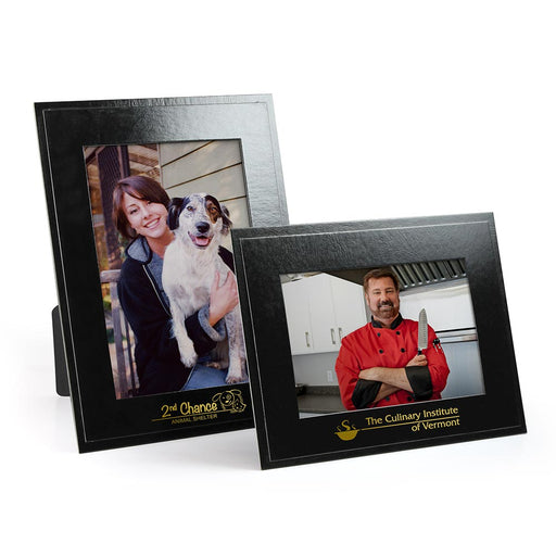 Glossy black cardboard frames with gold foil logo imprints