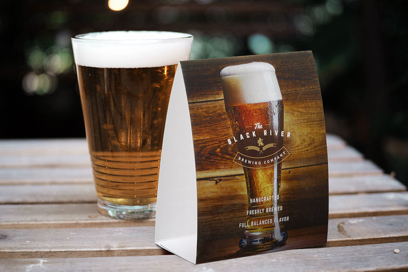Vertical table tent advertising a brewery
