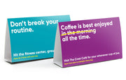 Horizontal table tents for a resort, advertising different amenities.