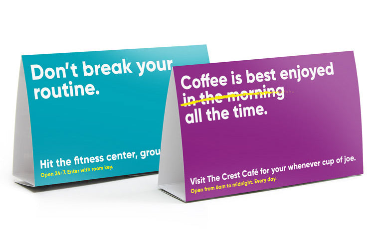 Horizontal table tents for a resort, advertising different amenities.