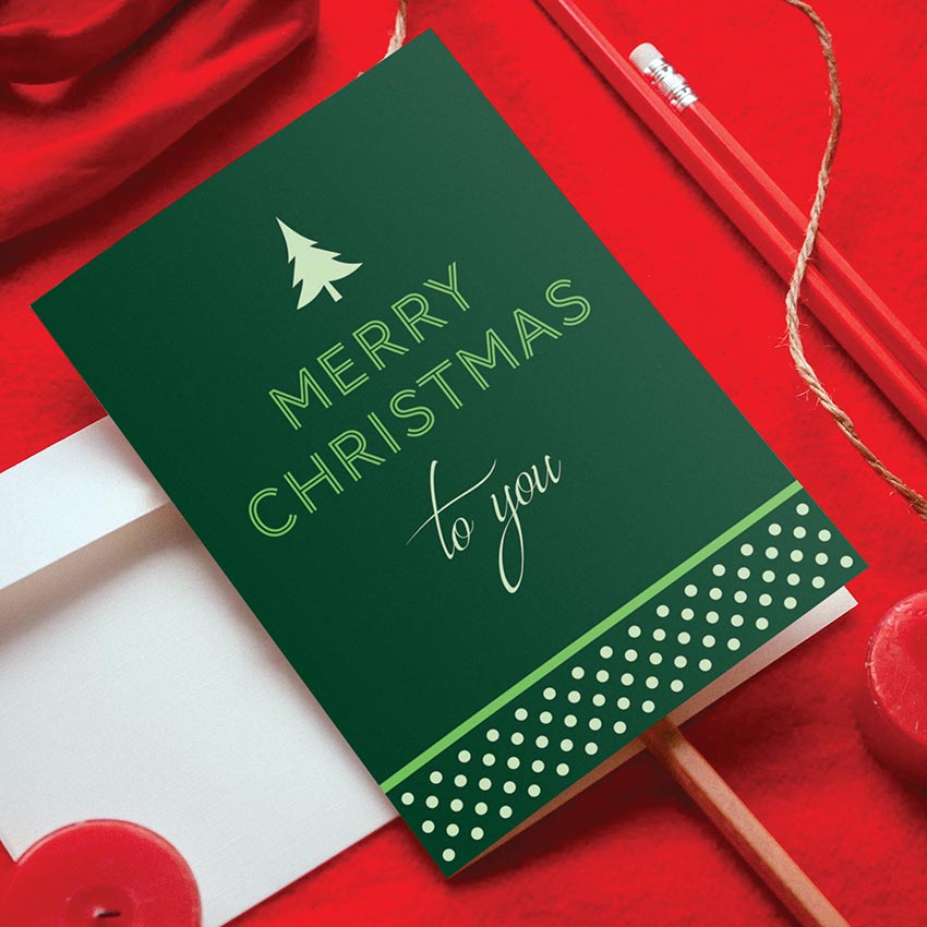Green vertical holiday card with polka dot design reads, Merry Christmas to you.