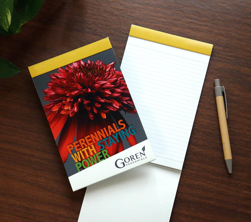 Custom printed 5x7 journal with paper cover printed with brand graphics.