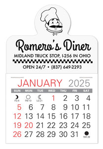 White calendar with circle on top with a graphic of a chef with hat and mustached. Below is an advertisement for a diner at a truck stop.