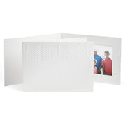 Horizontal photo folder with a frame opening for one photo. Golf dimpled texture all over the folder.