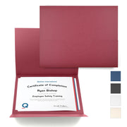 Burgundy certificate folder with color swatches for blue, black, white, and off-white.