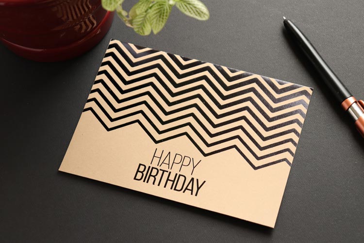 Kraft brown birthday card with black foil chevron design