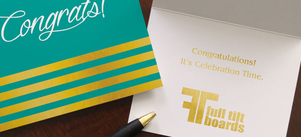 Teal congratulations greeting card with gold foil lines on the front cover and a sentiment and company logo inside the card.