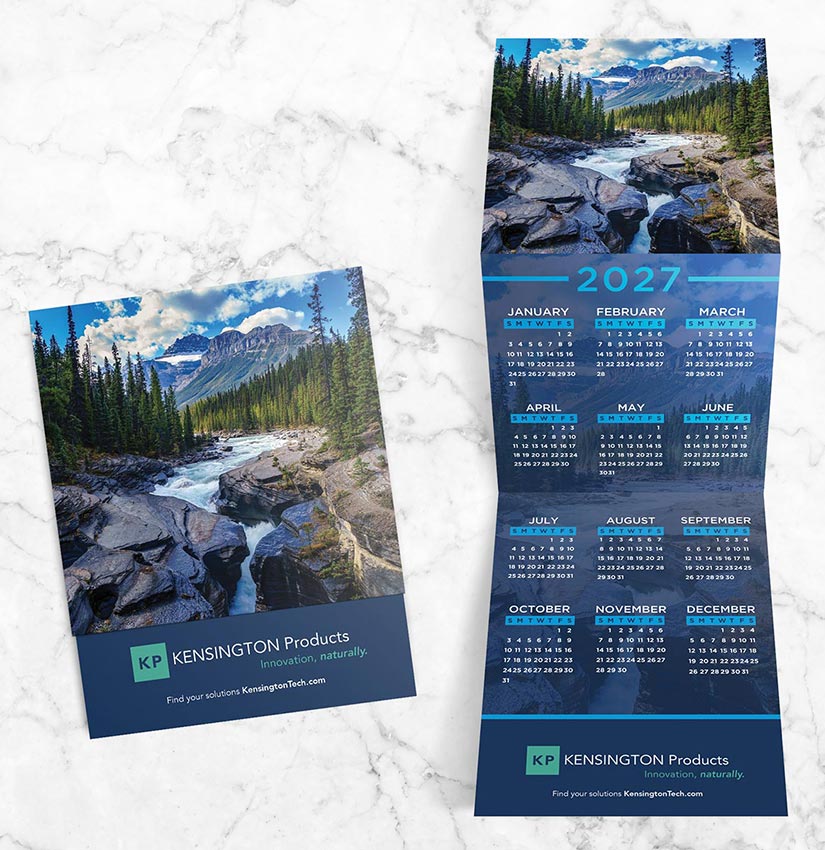 Trifold advertising calendar with scenic mountain river landscape design.
