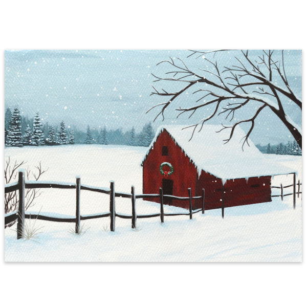 A red barn sits in a field covered in snow, with a simple Christmas wreath hanging on the front of the barn. A line of snow-covered evergreen trees sit in the distance as snow continues to fall.
