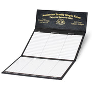 Black promotional desk calendar with gold foil logo imprint and flip-out phone index