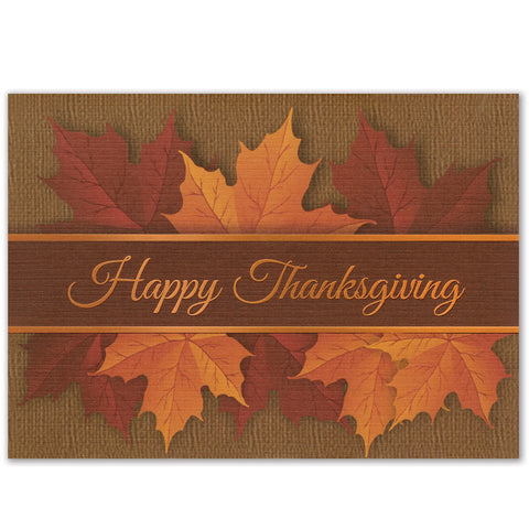 Autumn maple leaves with a script Happy Thanksgiving card design