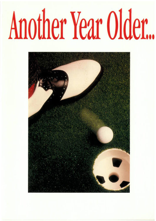 Someone pushes the golf ball in the hole with their foot on this gold greeting card