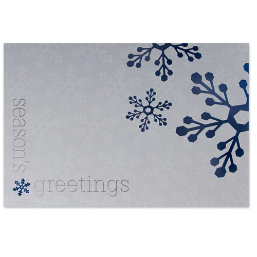 Silver holiday card with blue foil snowflake design