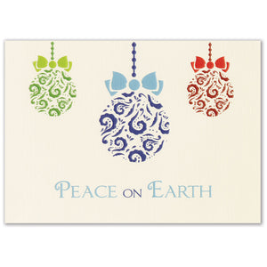 Ivory Christmas card with green, blue, and red holiday ornament design