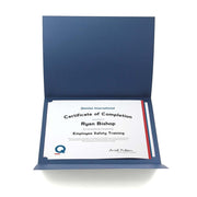 Navy blue certificate folder shown open with award framed inside.