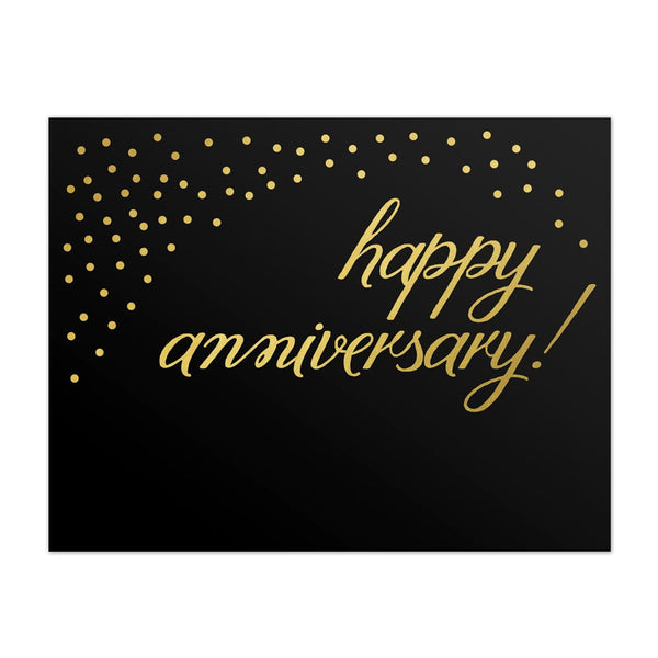 Black greeting card with gold foil bubbles and script font that says, happy anniversary!