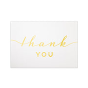 Simple gold foil thank you design on a subtle sparkling white paper stock