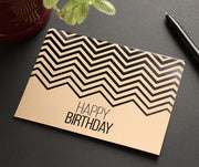 Kraft business birthday card on a desk