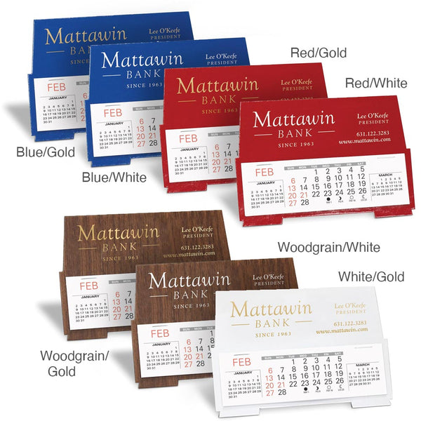 Small stand-up promotional desk calendars in blue, red, woodgrain, and white