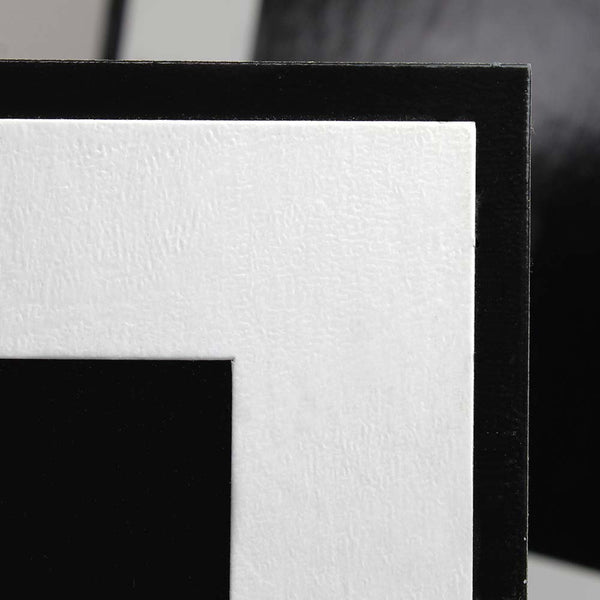 Detail of white leatherette and glossy black backing