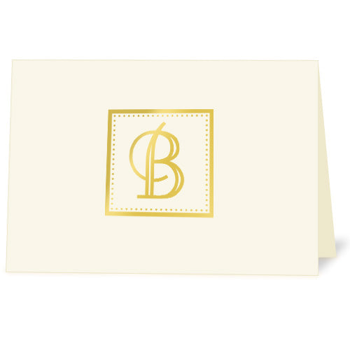 Ivory note card with metallic gold foil decorative monogram imprint.
