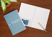 A custom printed promotional pad folio with branding for an investment firm