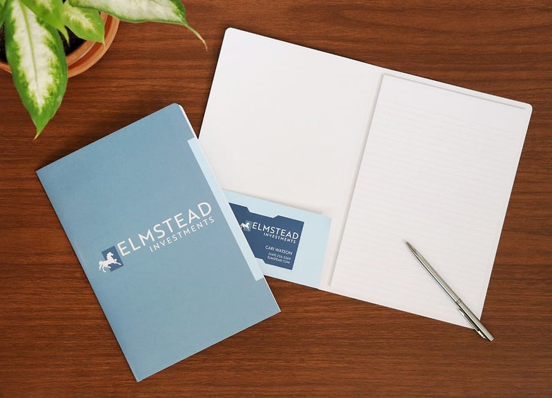 A custom printed promotional pad folio with branding for an investment firm