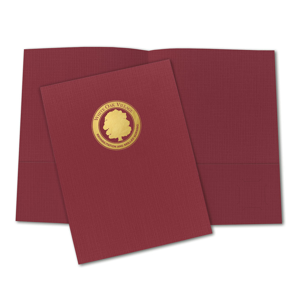 Burgundy linen pocket folder with gold foil stamped company logo